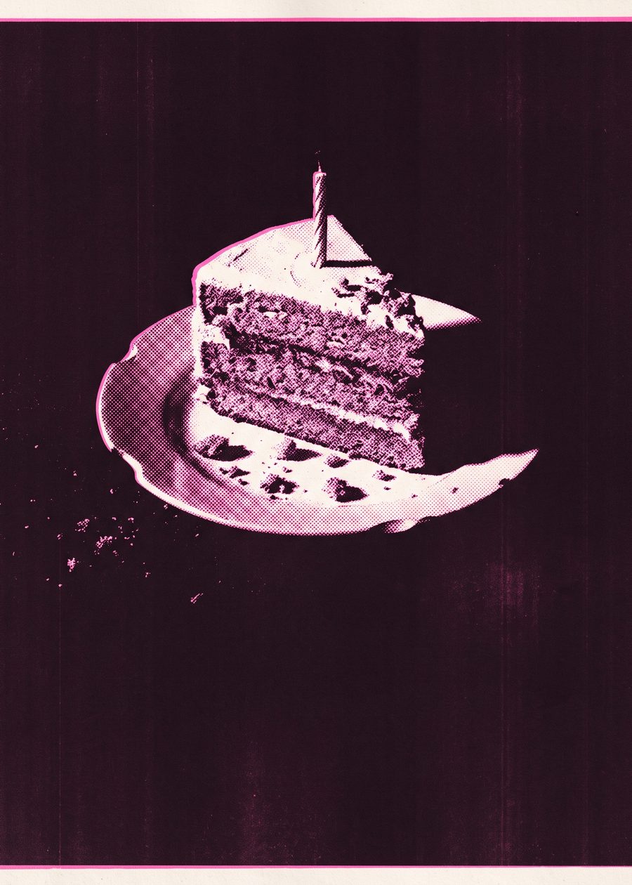 a slice of layer cake with one unlit candle on a chipped plate, crumbs scattered